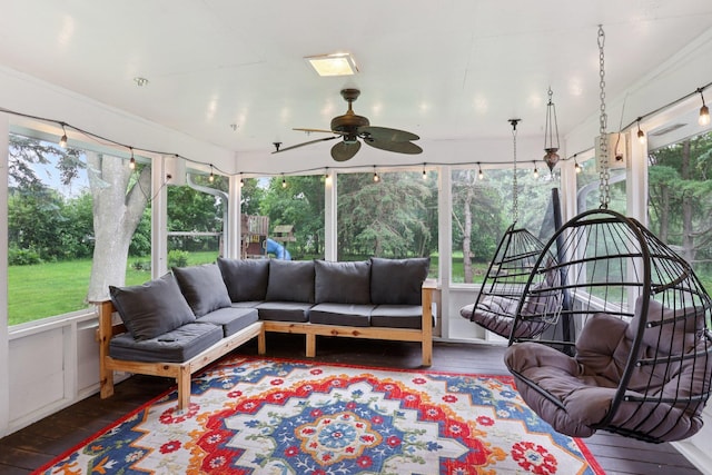 1985 Mabel Ct, Chaska, MN 55318 - sunroom / solarium with outdoor lounge area, healthy amount of natural light, and ceiling fan