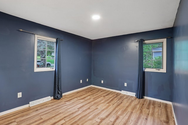 1985 Mabel Ct, Chaska, MN 55318 - empty room featuring plenty of natural light, light wood-style flooring, and recessed lighting