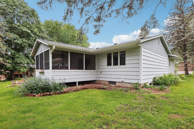 1985 Mabel Ct, Chaska, MN 55318 - rear view of house featuring a sunroom and a lawn