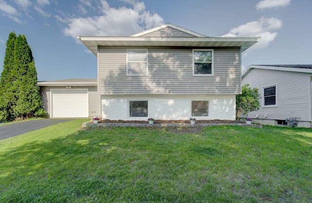1414 5th Ave SW, Rochester, MN 55902 - split level home featuring driveway, an attached garage, a front lawn, and brick siding
