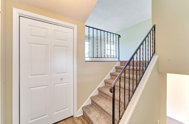 1414 5th Ave SW, Rochester, MN 55902 - staircase featuring wood finished floors and baseboards