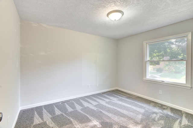 1414 5th Ave SW, Rochester, MN 55902 - carpeted empty room with a textured ceiling and baseboards