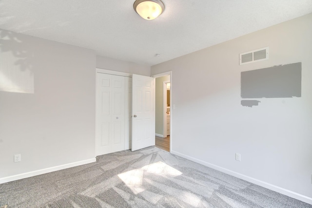1414 5th Ave SW, Rochester, MN 55902 - unfurnished bedroom with carpet flooring, baseboards, and a closet
