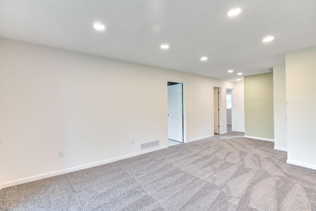 1414 5th Ave SW, Rochester, MN 55902 - spare room with recessed lighting, carpet flooring, and baseboards