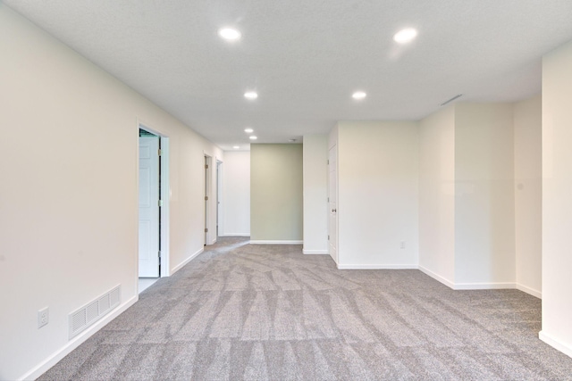 1414 5th Ave SW, Rochester, MN 55902 - carpeted empty room with recessed lighting and baseboards