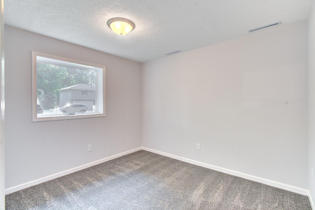 1414 5th Ave SW, Rochester, MN 55902 - spare room featuring carpet floors, baseboards, and a textured ceiling