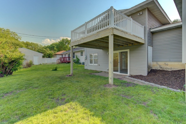 1414 5th Ave SW, Rochester, MN 55902 - back of house with a wooden deck and a lawn