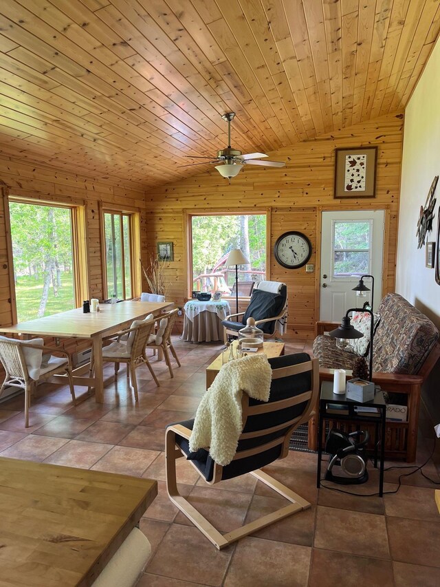 1760 Grindstone Is, International Falls, MN 56649 - living area with healthy amount of natural light, lofted ceiling, wood walls, and ceiling fan