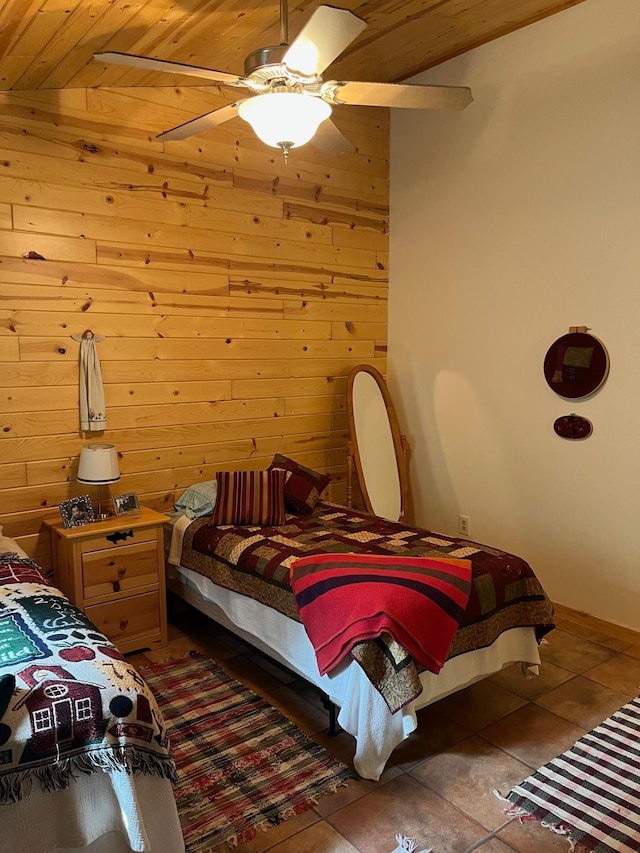 1760 Grindstone Is, International Falls, MN 56649 - tiled bedroom with wooden ceiling, wooden walls, and a ceiling fan