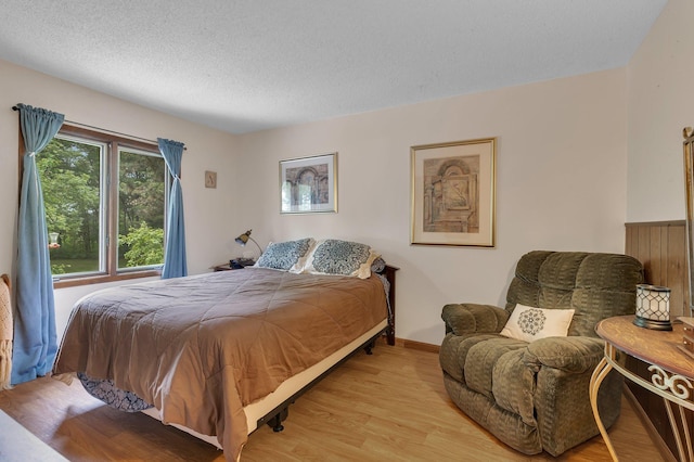 3566 State Highway 210, Baxter, MN 56425 - bedroom featuring wood finished floors and a textured ceiling
