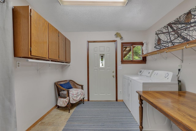 3566 State Highway 210, Baxter, MN 56425 - washroom with washer and clothes dryer, baseboards, cabinet space, and a textured ceiling