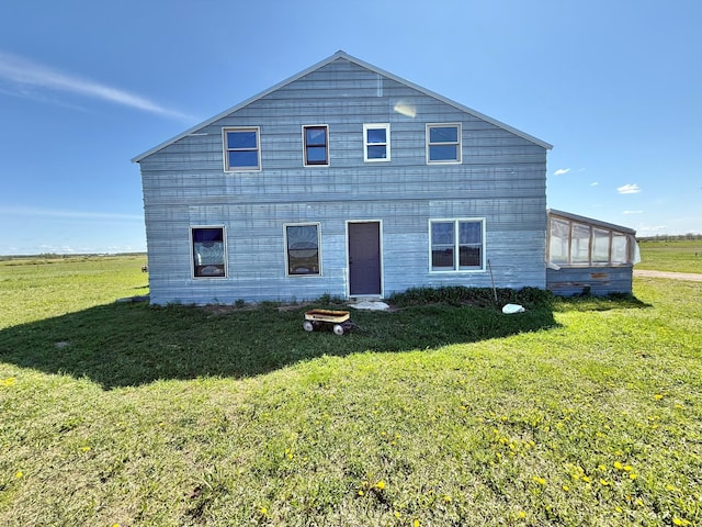 42810 620th Ave, Wadena, MN 56477 - back of property with a yard and a sunroom