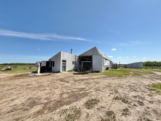 42810 620th Ave, Wadena, MN 56477 - rear view of property featuring a pole building and an outbuilding