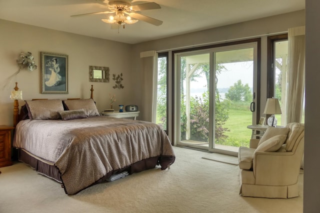 5225 217th St N, Forest Lake, MN 55025 - bedroom featuring access to outside, light carpet, and a ceiling fan