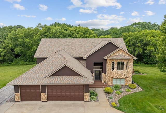26722 Rabbit Trl, Stanford Twp, MN 55398 - view of front of home featuring stone siding, a front lawn, an attached garage, concrete driveway, and roof with shingles