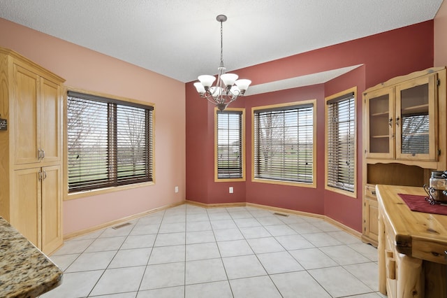 26722 Rabbit Trl, Stanford Twp, MN 55398 - unfurnished dining area with a chandelier and light tile patterned floors