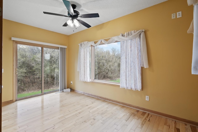 26722 Rabbit Trl, Stanford Twp, MN 55398 - unfurnished room featuring ceiling fan and wood finished floors