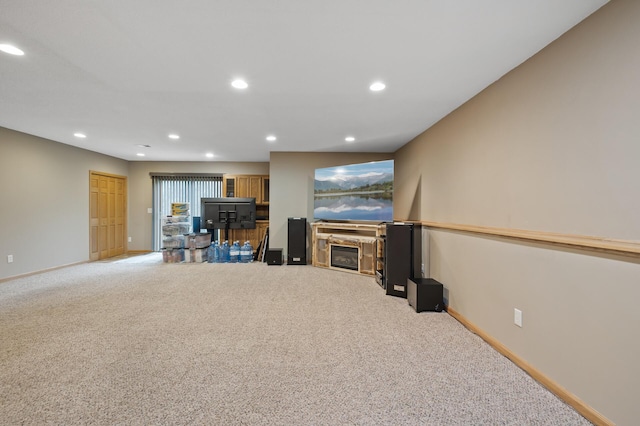 26722 Rabbit Trl, Stanford Twp, MN 55398 - living area featuring carpet floors, recessed lighting, and a glass covered fireplace