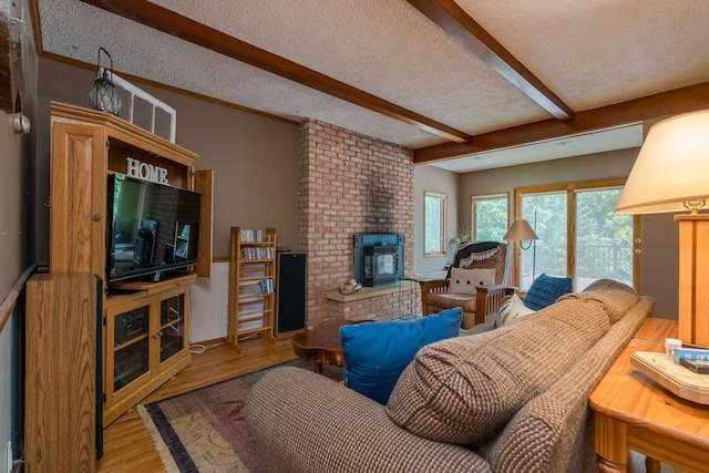 242 Skyview Ln, Mankato, MN 56001 - living area featuring a fireplace, beam ceiling, wood finished floors, and a textured ceiling