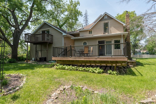 242 Skyview Ln, Mankato, MN 56001 - rear view of property featuring a yard, a chimney, a balcony, and a deck