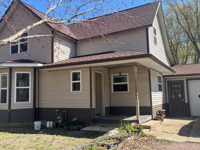 718 9th St N, Mountain Lake, MN 56159 - view of front facade with a shingled roof
