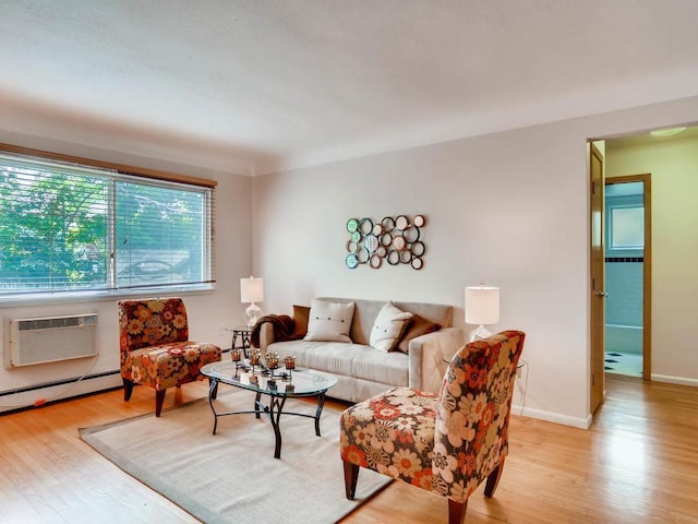 656 Ashland Ave Unit 11, Saint Paul, MN 55104 - living area with a wall unit AC, light wood finished floors, and baseboard heating