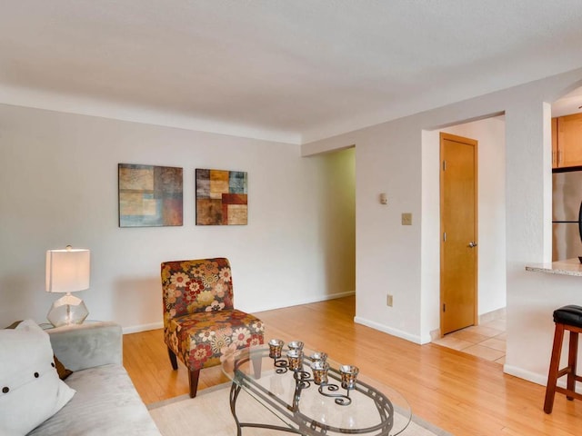 656 Ashland Ave Unit 11, Saint Paul, MN 55104 - living room featuring light wood finished floors and arched walkways