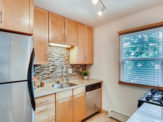 656 Ashland Ave Unit 11, Saint Paul, MN 55104 - kitchen with appliances with stainless steel finishes, a baseboard radiator, light brown cabinets, and decorative backsplash