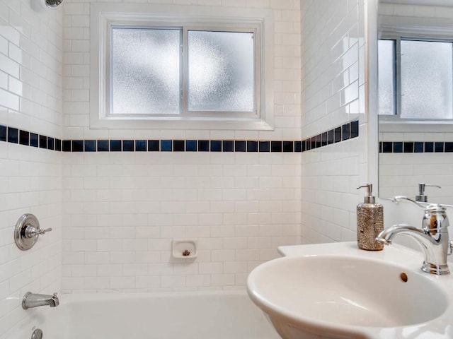 656 Ashland Ave Unit 11, Saint Paul, MN 55104 - full bathroom with healthy amount of natural light and shower / washtub combination