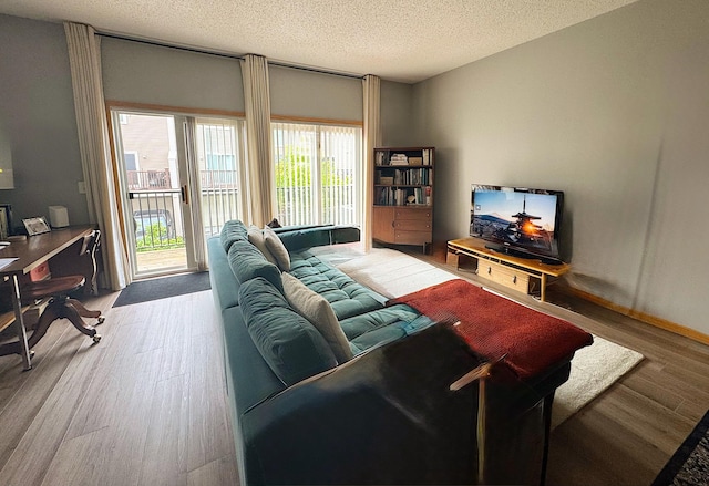 4332 Victor Path Unit 6, Hugo, MN 55038 - living area with wood finished floors, a textured ceiling, and an office area