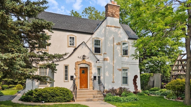 5341 Nicollet Ave, Minneapolis, MN 55419 - tudor house with stucco siding, a chimney, and roof with shingles