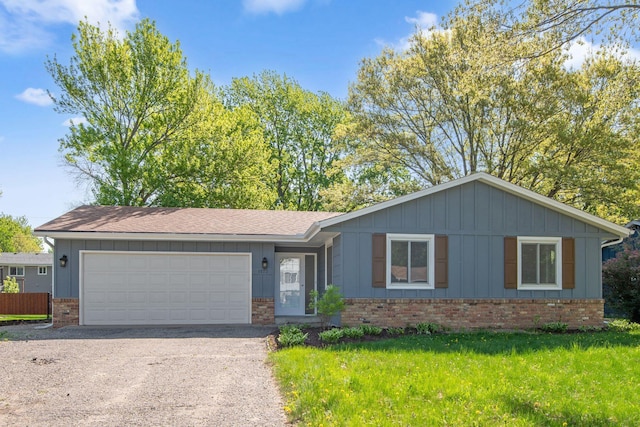 1173 Jefferson St S, Shakopee, MN 55379 - ranch-style home featuring brick siding, driveway, a garage, board and batten siding, and a front yard
