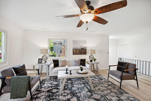 1173 Jefferson St S, Shakopee, MN 55379 - living area featuring a ceiling fan, light wood-type flooring, and baseboards