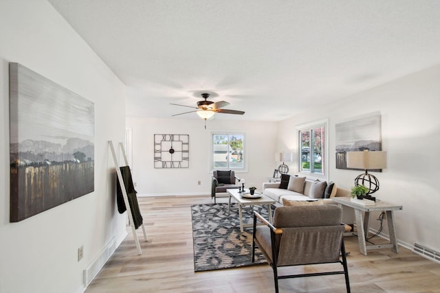 1173 Jefferson St S, Shakopee, MN 55379 - living area with a ceiling fan, light wood-type flooring, and baseboards