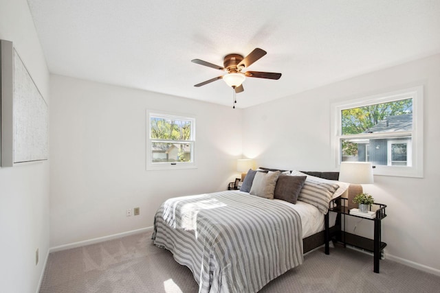 1173 Jefferson St S, Shakopee, MN 55379 - bedroom with multiple windows, carpet floors, baseboards, and a ceiling fan