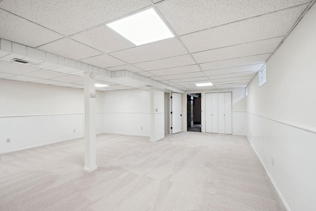 1173 Jefferson St S, Shakopee, MN 55379 - finished below grade area with carpet, baseboards, and a paneled ceiling