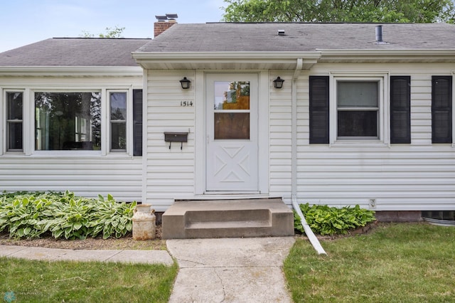 1514 2nd St N, Fargo, ND 58102 - doorway to property with a chimney and roof with shingles