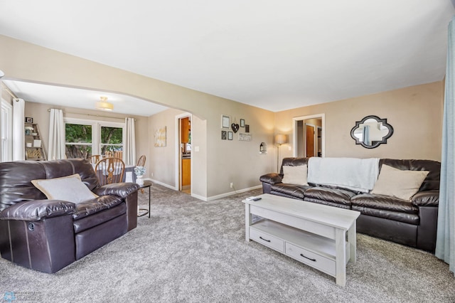 1514 2nd St N, Fargo, ND 58102 - living room with arched walkways, carpet flooring, and baseboards