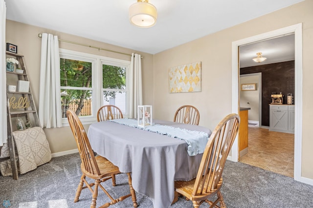 1514 2nd St N, Fargo, ND 58102 - tiled dining room featuring carpet floors and baseboards