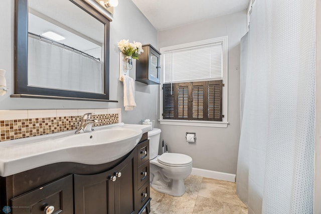 1514 2nd St N, Fargo, ND 58102 - full bathroom with vanity, backsplash, toilet, baseboards, and curtained shower