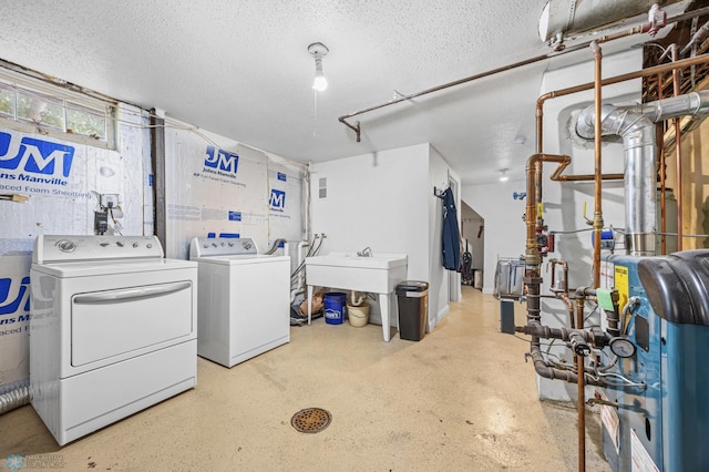 1514 2nd St N, Fargo, ND 58102 - laundry room featuring independent washer and dryer, a textured ceiling, and a sink