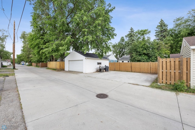 1514 2nd St N, Fargo, ND 58102 - view of patio with an outbuilding and a garage