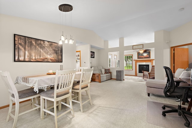 4645 Eagle Ridge Ln, Monticello, MN 55362 - carpeted dining room with vaulted ceiling, a tiled fireplace, an office area, and baseboards