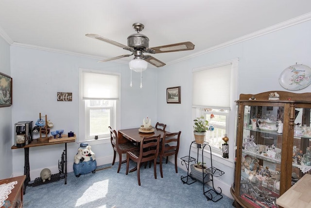 425 12th Ave S, Fargo, ND 58103 - carpeted dining room with ornamental molding and a ceiling fan