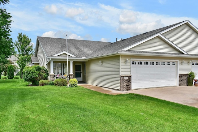 705 14th St, Wabasha, MN 55981 - view of front facade featuring brick siding, a garage, concrete driveway, a front yard, and a shingled roof