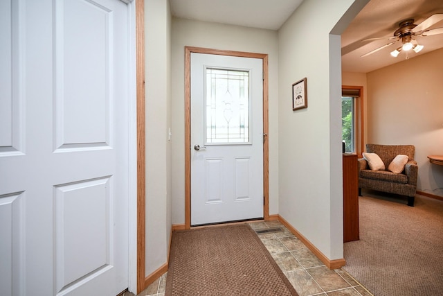 705 14th St, Wabasha, MN 55981 - doorway featuring plenty of natural light, ceiling fan, baseboards, and light colored carpet