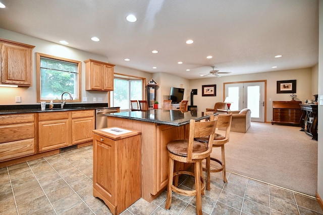 705 14th St, Wabasha, MN 55981 - kitchen featuring a sink, dishwasher, a kitchen island, recessed lighting, and a breakfast bar