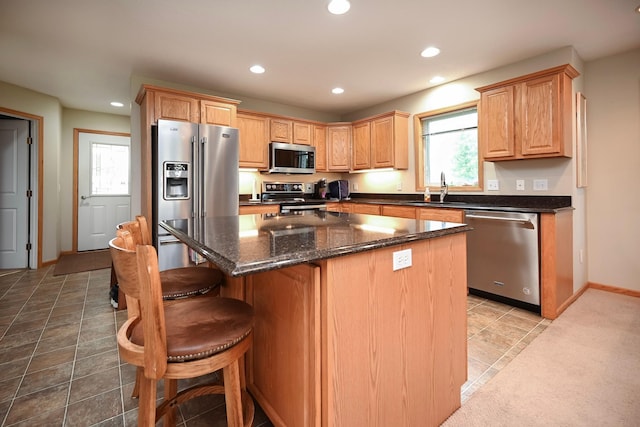 705 14th St, Wabasha, MN 55981 - kitchen with appliances with stainless steel finishes, recessed lighting, a kitchen island, baseboards, and a sink