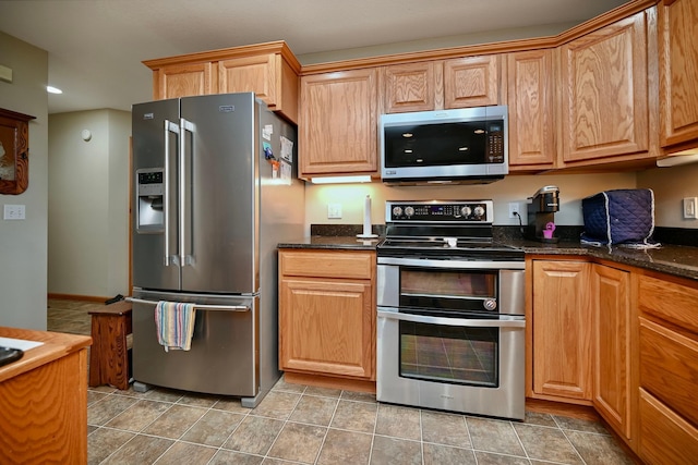 705 14th St, Wabasha, MN 55981 - kitchen with stainless steel appliances, recessed lighting, and dark stone counters