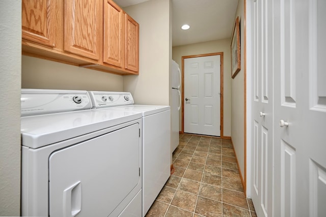 705 14th St, Wabasha, MN 55981 - laundry room featuring cabinet space, washing machine and dryer, stone finish flooring, baseboards, and recessed lighting